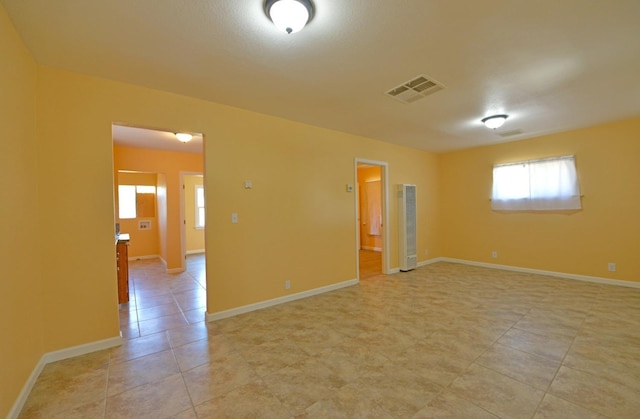 339 N Delno Ave, Fresno, CA 93706 - spare room featuring healthy amount of natural light, light tile patterned floors, and baseboards