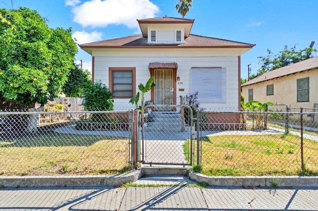 bungalow with a front yard