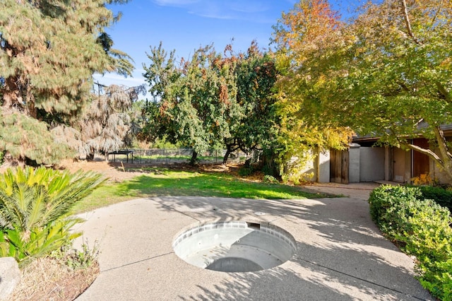 view of patio with a hot tub