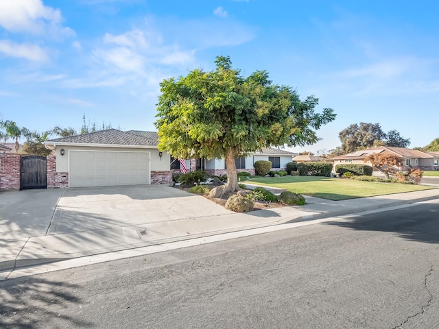 view of front of property with a garage and a front yard