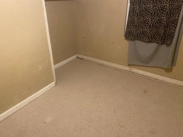 interior space featuring baseboards