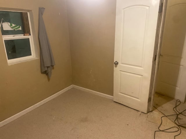 empty room with baseboards