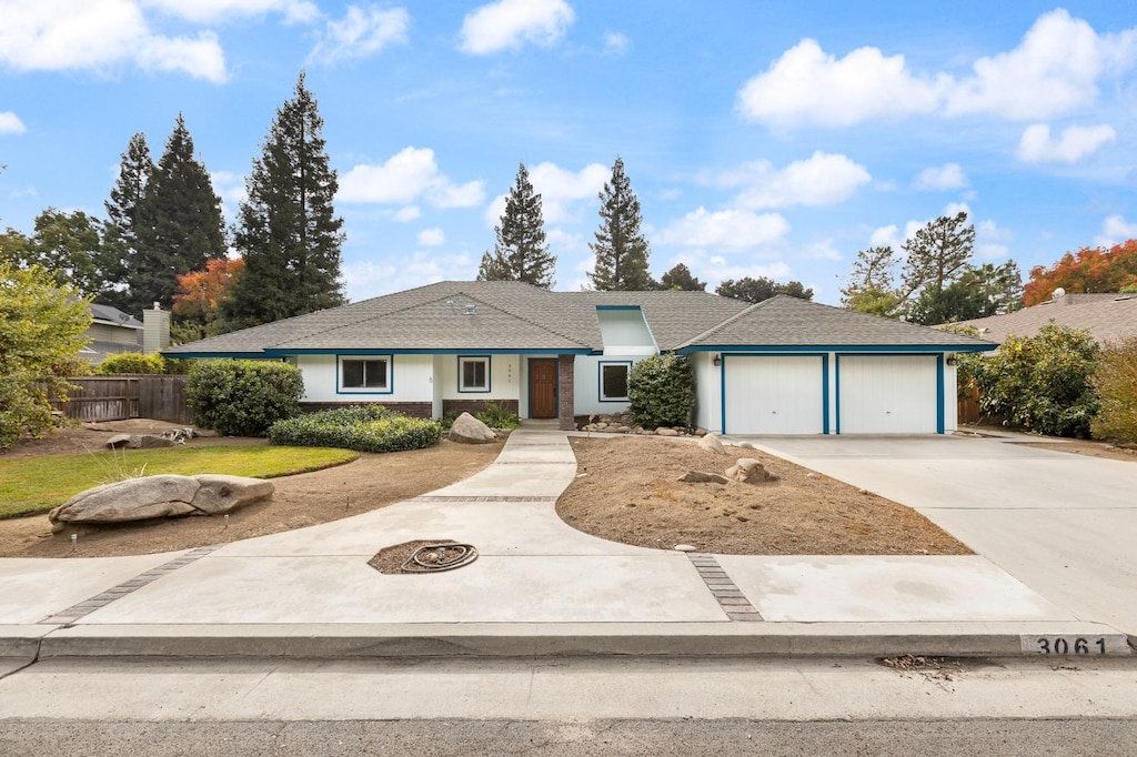 single story home featuring a garage