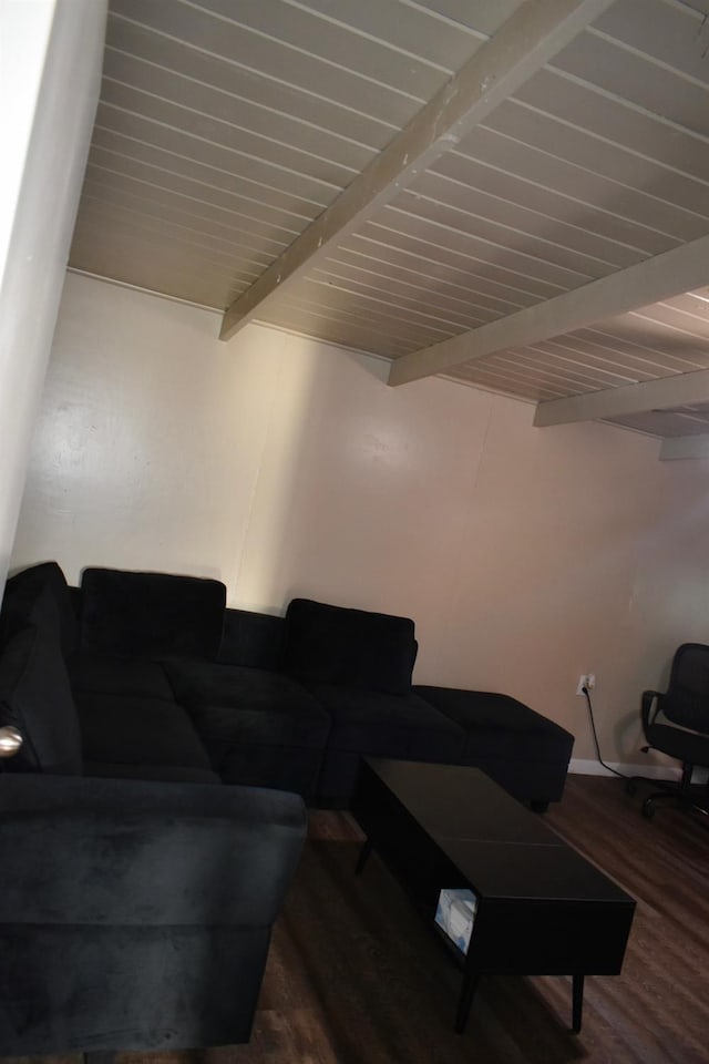 living room with beam ceiling, hardwood / wood-style floors, and wood ceiling