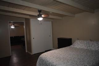 bedroom with beam ceiling and ceiling fan