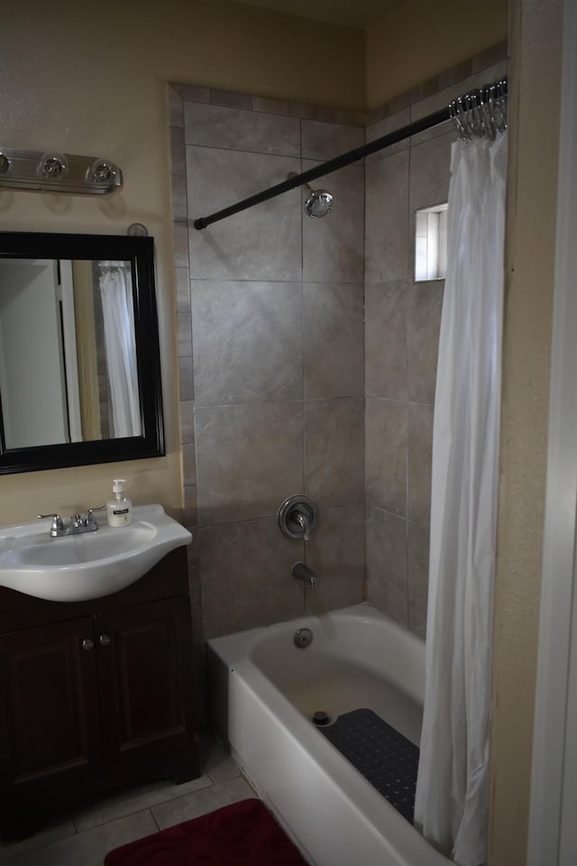 bathroom featuring tile patterned flooring, shower / bath combination with curtain, and vanity