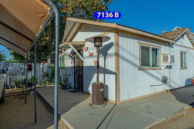 view of side of property featuring cooling unit