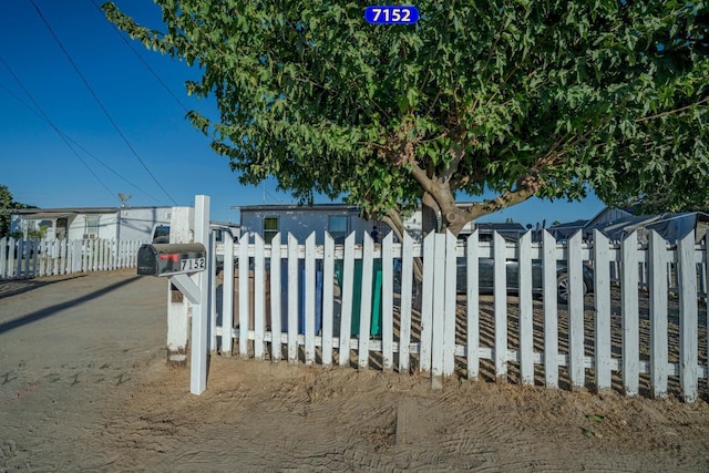 view of gate featuring fence