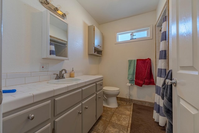 full bathroom featuring vanity and toilet