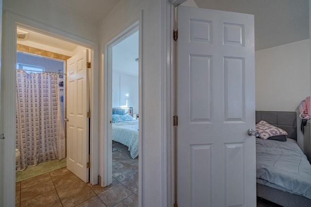 corridor with tile patterned floors