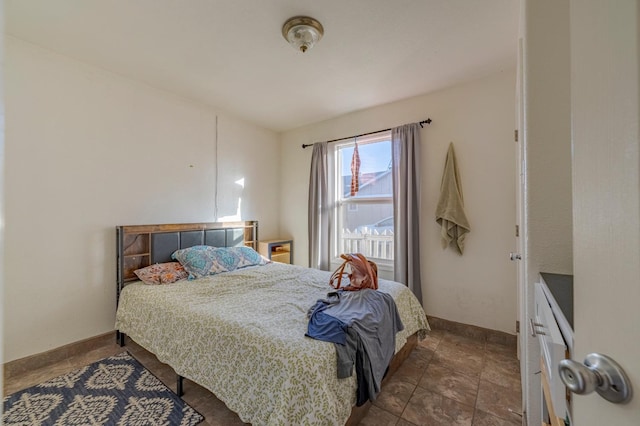 bedroom featuring baseboards