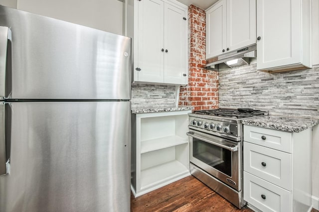 kitchen featuring white cabinetry, light stone counters, and stainless steel appliances