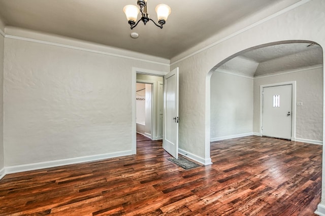 interior space featuring crown molding, dark hardwood / wood-style flooring, and an inviting chandelier