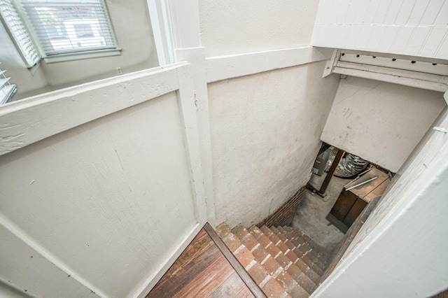 stairs featuring wood-type flooring