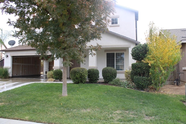 view of front facade with a garage and a front yard