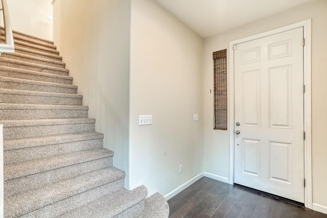 foyer entrance with dark hardwood / wood-style flooring