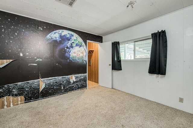 unfurnished bedroom featuring visible vents