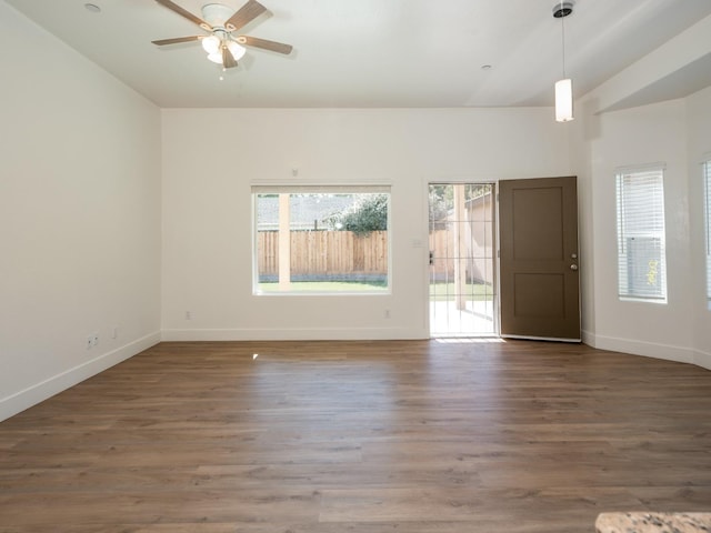 unfurnished room with dark wood-type flooring, ceiling fan, and lofted ceiling