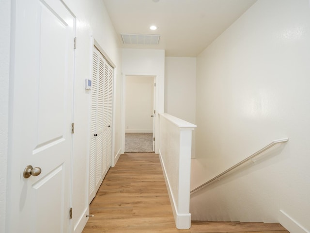 corridor with light wood-type flooring