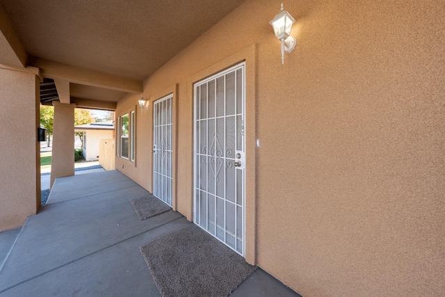 property entrance featuring a patio area