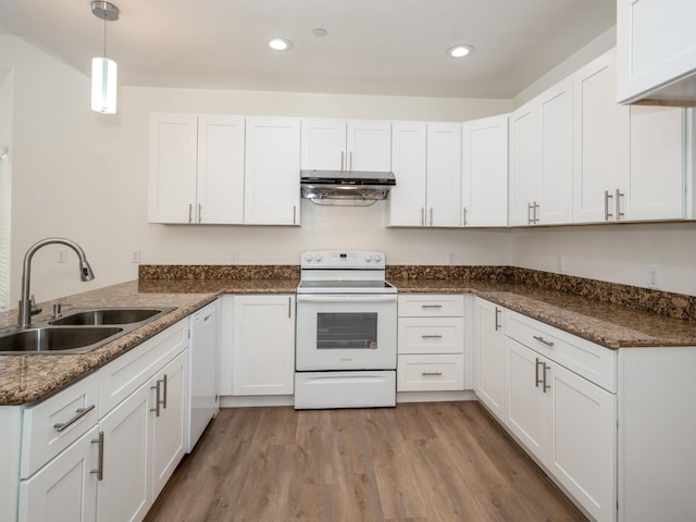 kitchen featuring white cabinets, white appliances, sink, and decorative light fixtures