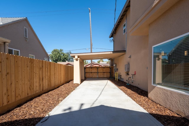 view of property exterior with a carport