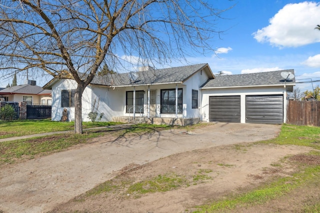 ranch-style house with a garage and a front yard