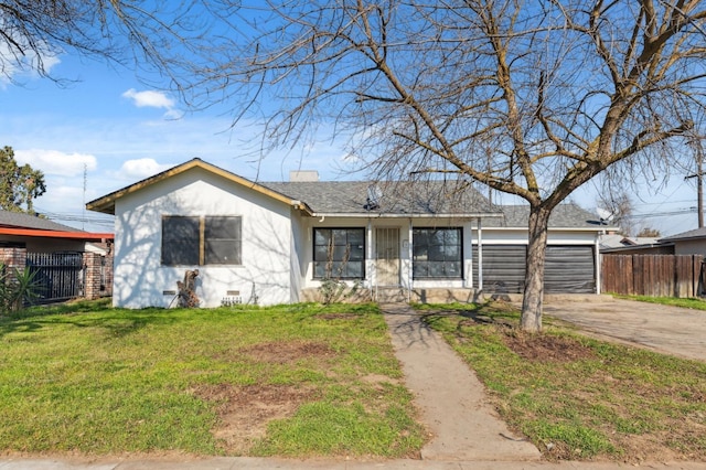 single story home with a garage and a front lawn