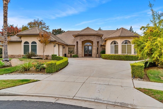 view of front of home featuring a garage and french doors