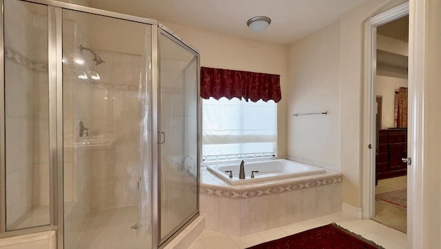 bathroom with tile patterned floors and plus walk in shower