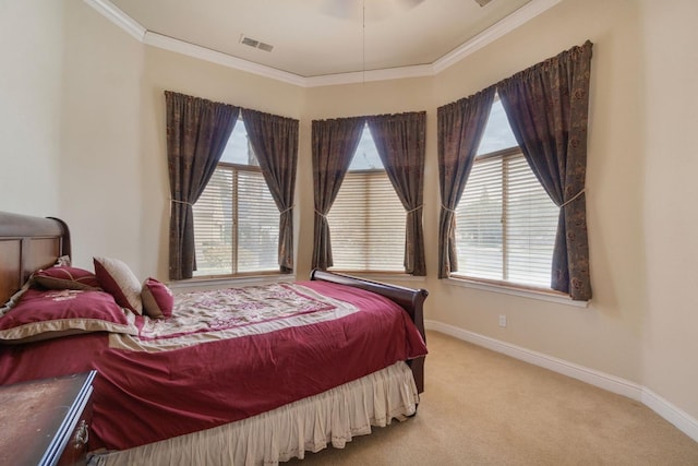 carpeted bedroom with ornamental molding