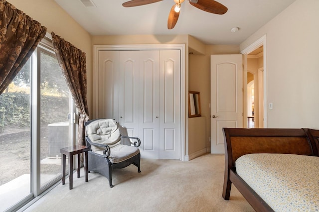 carpeted bedroom featuring a closet, ceiling fan, and access to exterior