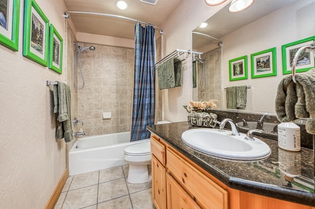 full bathroom with shower / bath combination with curtain, tile patterned floors, vanity, a textured ceiling, and toilet