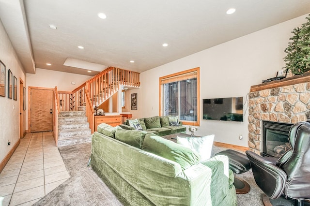 tiled living room featuring a fireplace