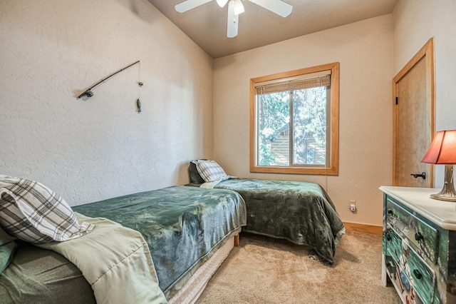 bedroom with vaulted ceiling, light carpet, and ceiling fan