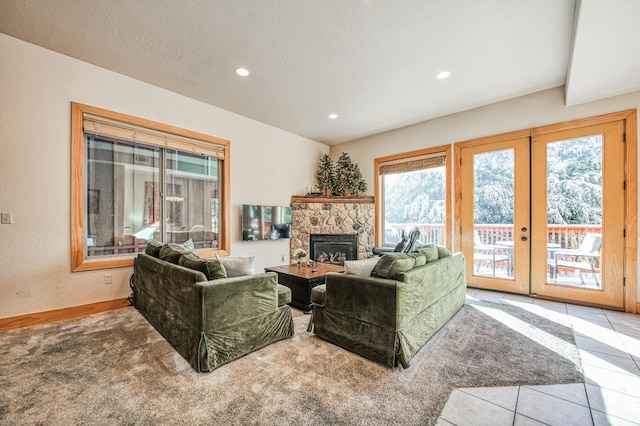 living room featuring a fireplace, light tile patterned flooring, a textured ceiling, and french doors