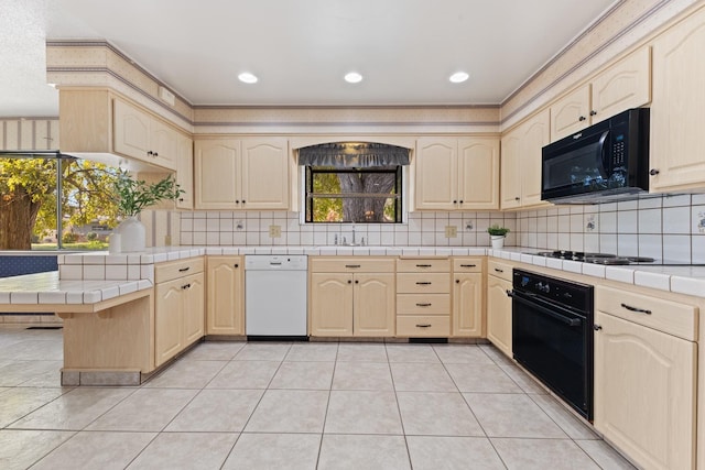 kitchen featuring tasteful backsplash, tile countertops, light tile patterned floors, and black appliances