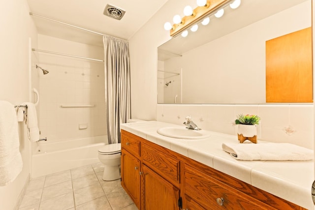 full bathroom featuring tile patterned flooring, vanity, shower / tub combo with curtain, and toilet