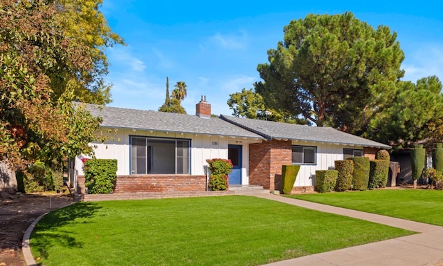 ranch-style house with a front yard