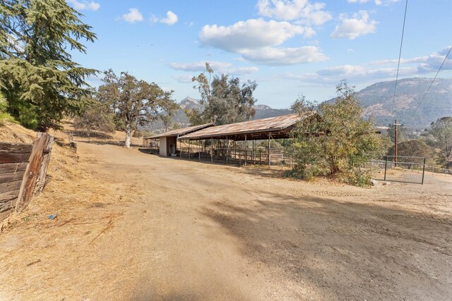 view of street with a mountain view and a rural view