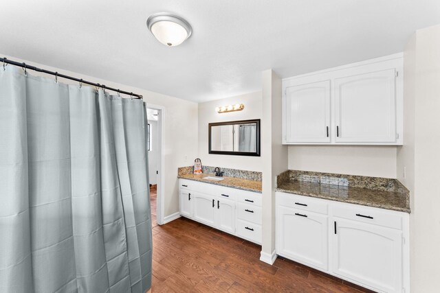 bathroom featuring wood-type flooring and vanity