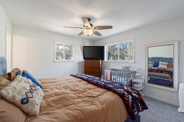 carpeted bedroom with ceiling fan