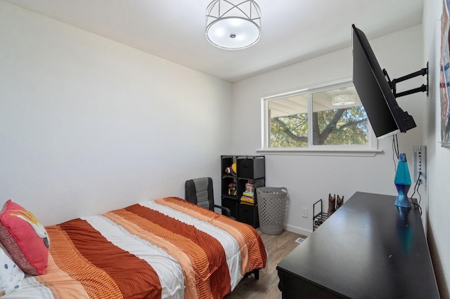 bedroom with wood-type flooring