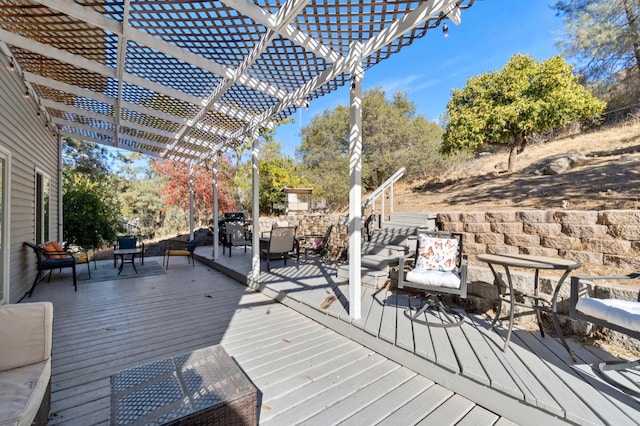 wooden deck featuring a pergola