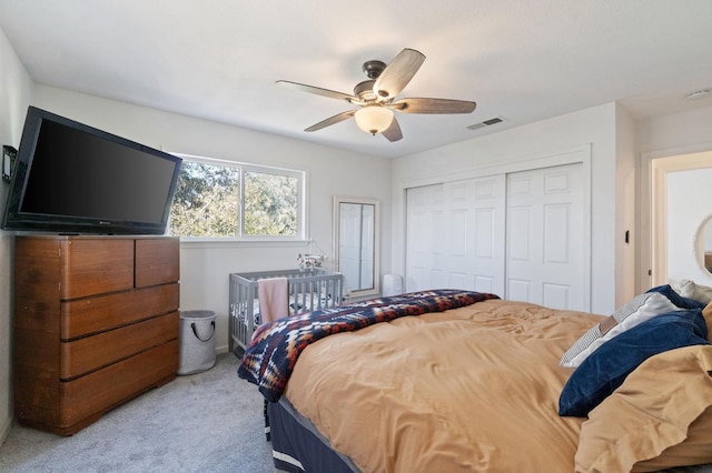 bedroom with light carpet and ceiling fan