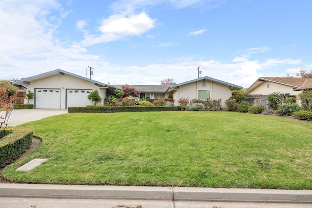 ranch-style home featuring a garage and a front lawn