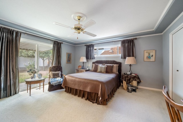 bedroom with ceiling fan, carpet floors, crown molding, and multiple windows