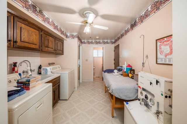 laundry room featuring washer / clothes dryer, ceiling fan, and sink