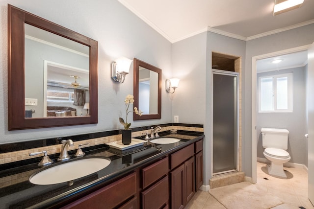 bathroom with vanity, tile patterned floors, crown molding, toilet, and a shower with shower door