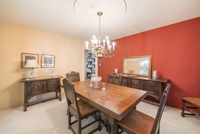 carpeted dining space featuring a notable chandelier